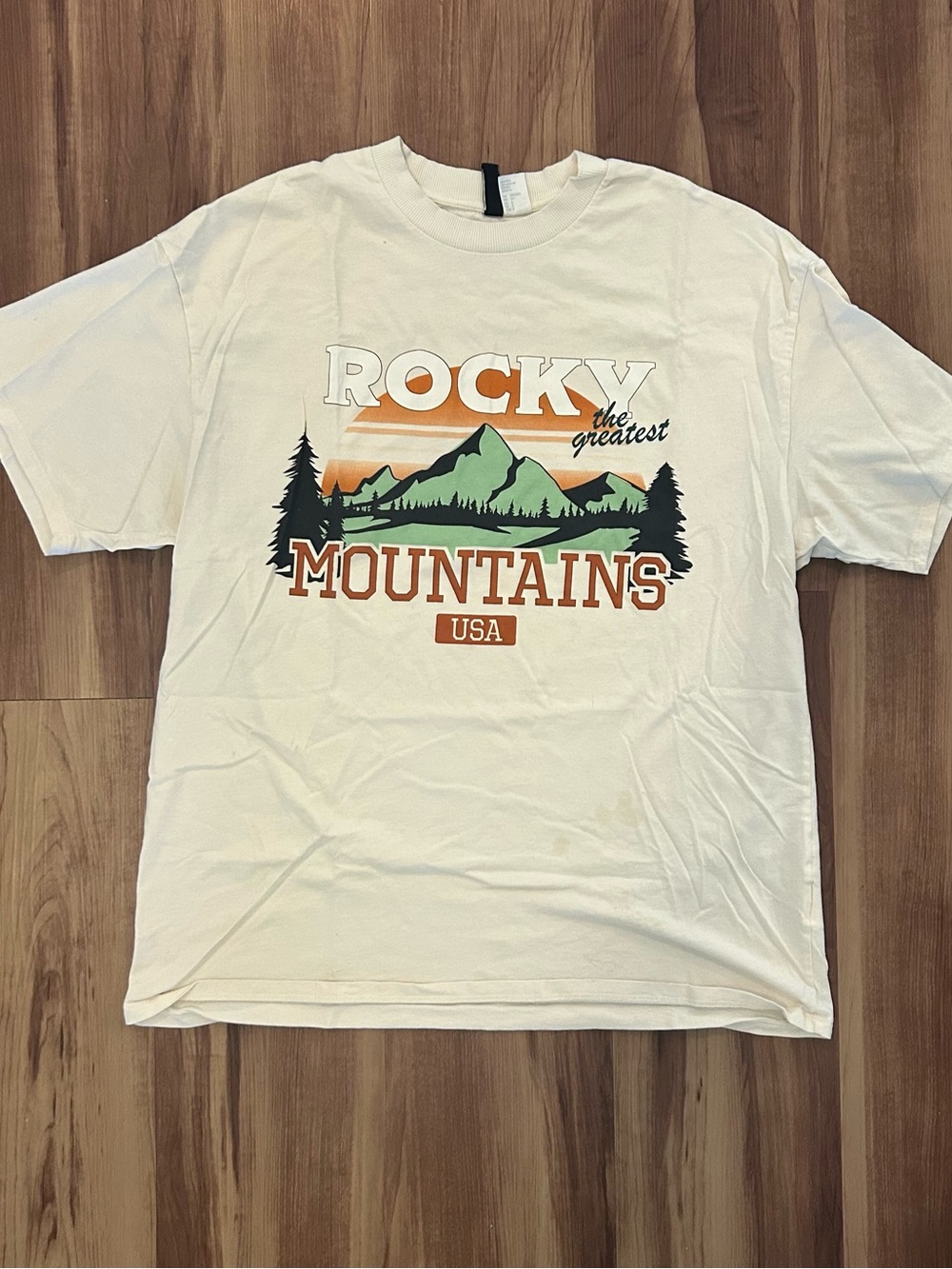 Divided White Rocky Mountains Graphic Tee with Green & Orange Print